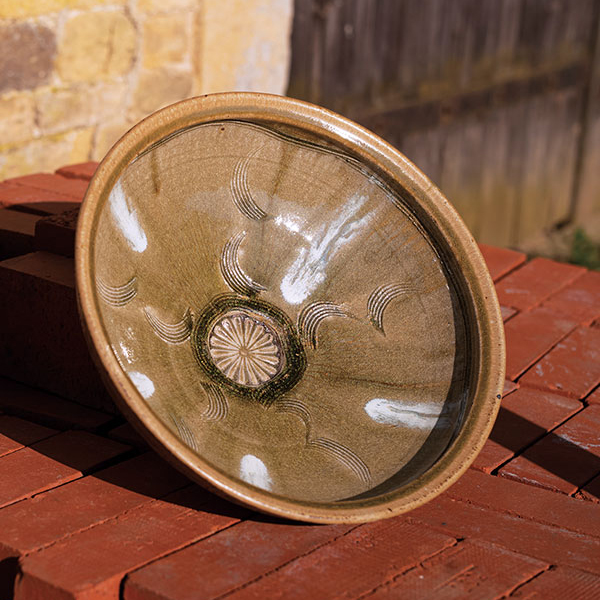 1 Phil Rogers’ large bowl, stoneware, impressed flower, ash glaze with nuka pours.