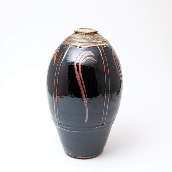2  Phil Rogers’ tall bottle, 17¾ in. (45 cm) in height, stoneware, tenmoku with finger wipes.