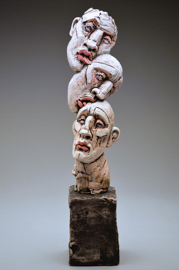 4 Head Stack, 24 in. (61 cm) in height, ceramic. 