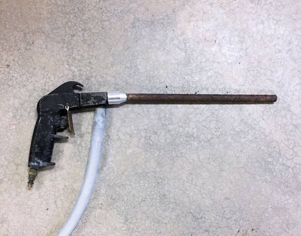 5 Repurposed soda blaster, with customized steel extension pipe is used to spray soda solution during firings. 