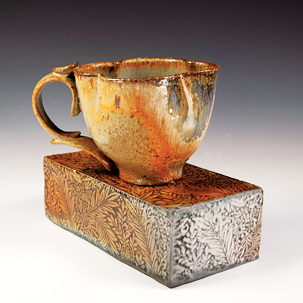 Craggy teacup on brick, wheel-thrown stoneware, soda fired to cone 10, 2021.