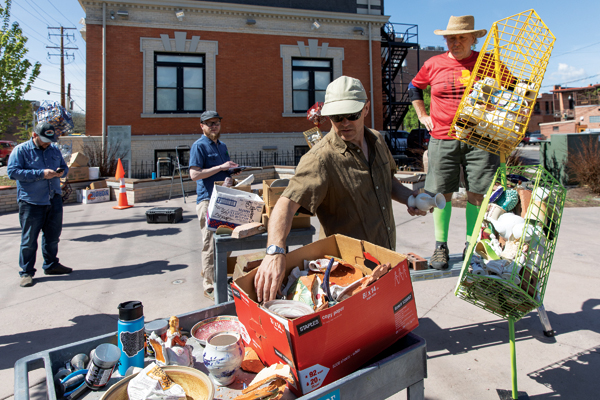 6 Missoula Art Museum staff assist Harrison during the installation.