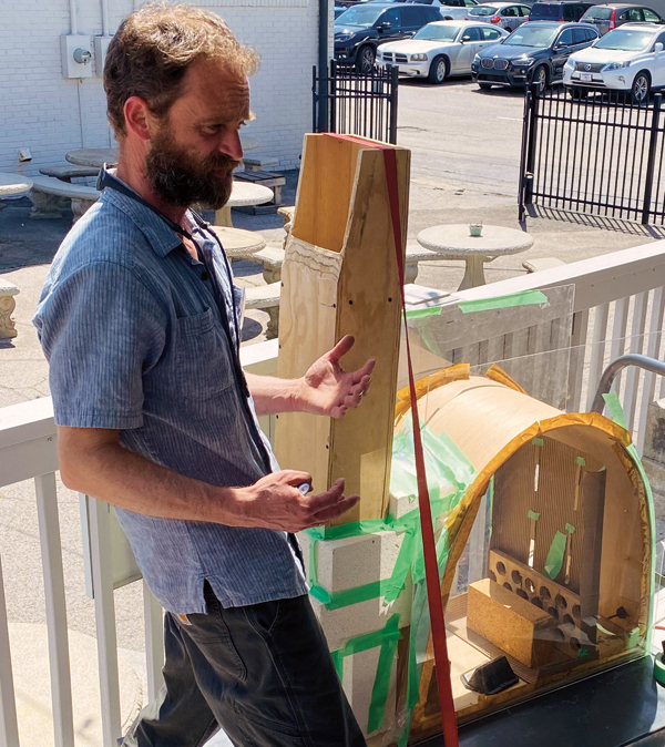 7 Presenter William Baker using a model kiln to show how flame and soda move during firings.