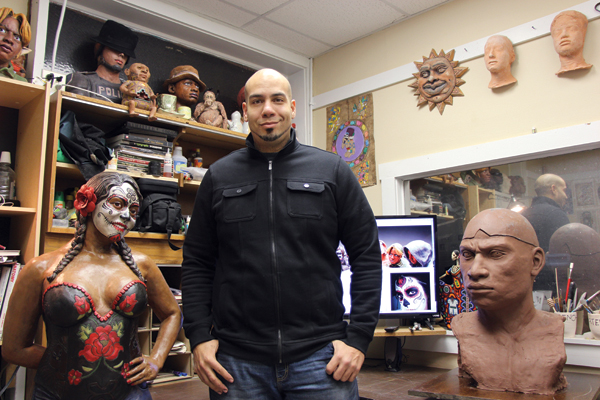 Nathan Murray in his studio surrounded by his work.
