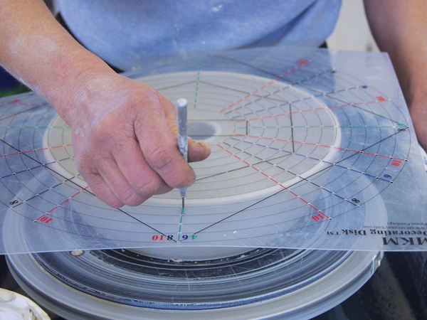6 Mark the exterior rim evenly for fluting using an MKM Decorating Disk, or simply by sight.