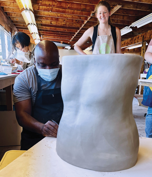 19 Instructor Ebitenyefa Baralaye, pictured here, led the 2022 “Big Impressions: Free-Form Press-Molds” workshop, which focused on creating large-scale sculptural ceramic forms at the Haystack Mountain School of Crafts. 
