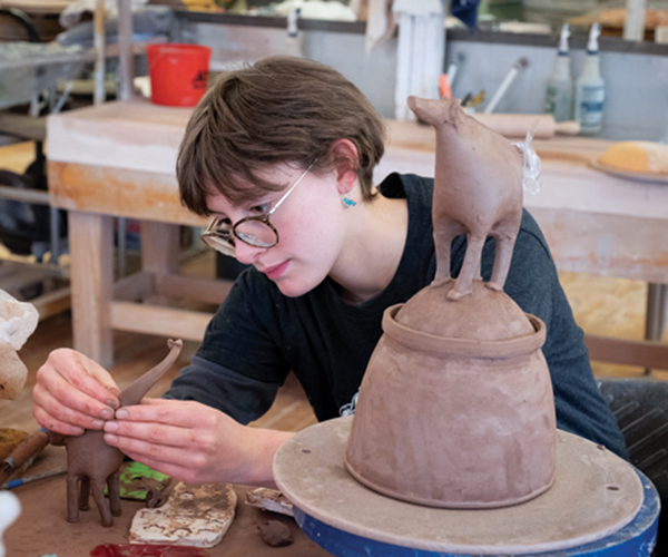 16 Penland student Celia Felberg in the Penland School of Craft clay studio. Photo: Robin Dreyer. 