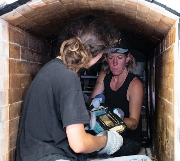 18 Instructor Courtney Martin unloading the small Penland School of Craft wood kiln. Photo: Robin Dreyer. 