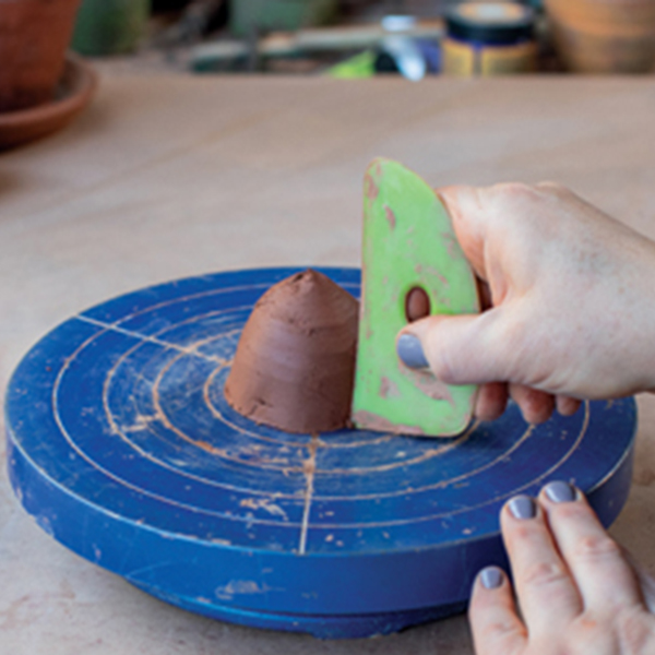 1 Rough out the solid reamer head shape using a banding wheel and rib.