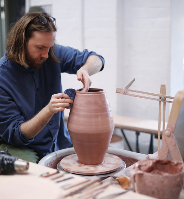 2 Gadsby throwing a large, lidded-jar form. 