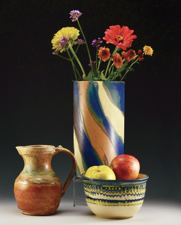 10 Left to right: David Hergesheimer’s stoneware pitcher; Evelyn LaMers’ stoneware vase; Michele Dutcher’s bowl, agate (mixed clay) stoneware.