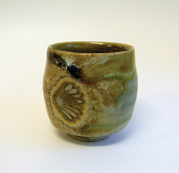 2 Yunomi, 182G clay body, Flashing Wood-Ash Glaze, placed on a shell, refired from a dry wood firing to cone 6 in oxidation. 