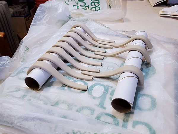 6 Drape handles over tubes to firm up.