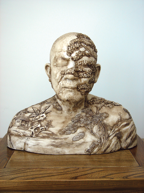 7 Ah Xian’s China, China-Bust 70, 17 in. (44 cm) in length, porcelain, carved relief, bitumen stain, landscape design, 2002.