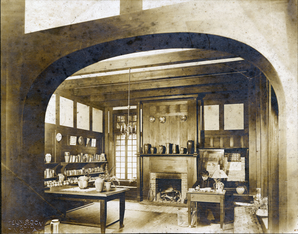 1 Desiree Roman seated in the salesroom of Newcomb Pottery in the Crafts building on Newcomb Camp Street campus, ca. 1905–10. Newcomb Archives—Photo Archives Collection.