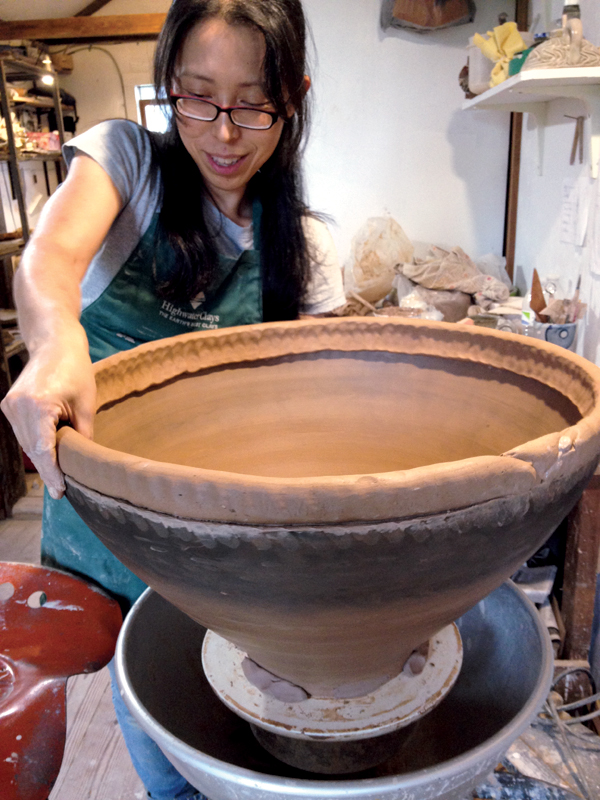 6 Hitomi Shibata adding a coil to a large jar.