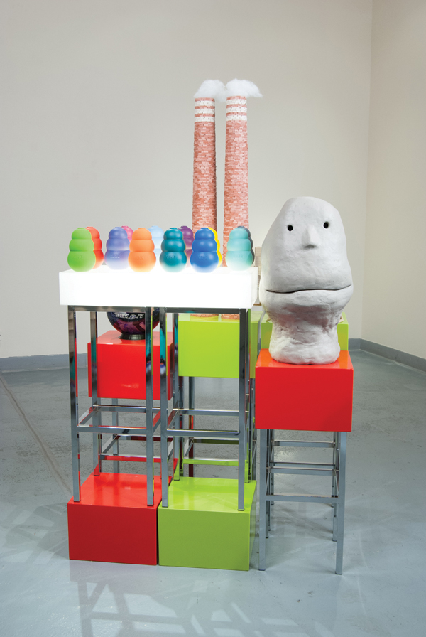 2 The Story That Isn’t as Good, 5 ft. 8 in. (1.7 m) in height, slip-cast and hand-built earthenware with acrylic paint, fluorescent tubes, acrylic, air-dry clay, polyester fiber, wood, bowling ball, found and reassembled bar stools, 2009.