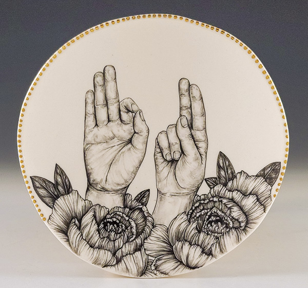 2 Mallory Wetherell’s FU Decorative Plate, 6½ in. (16.5 cm) in width, hand-painted porcelain, fired to cone 5, gold luster, 2024.