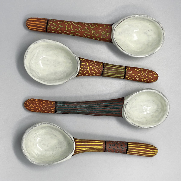 4 Spoons, 10 in. (25.4 cm) in length, handbuilt earthenware, underglazes, fired to cone 4.
