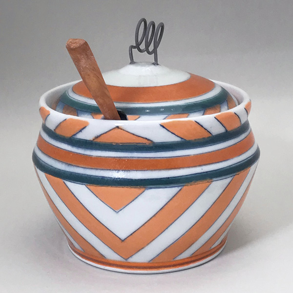 9 Sugar Jar with Orange and Blue Stripes, 6 in. (15.2 cm) in height, wheel-thrown porcelain, underglaze inlays, Kanthal wire, wooden spoon.