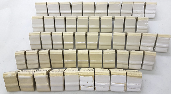 1 For those of you who understand the UMF and Stull, these tiles are my recreation of the Stull chart at cone 6. SiO2 increases from left to right and Al2O3 increases from bottom to top. Flux ratio Na2O:CaO is 0.3:0.7 and B2O3 is 0.15 across the board.