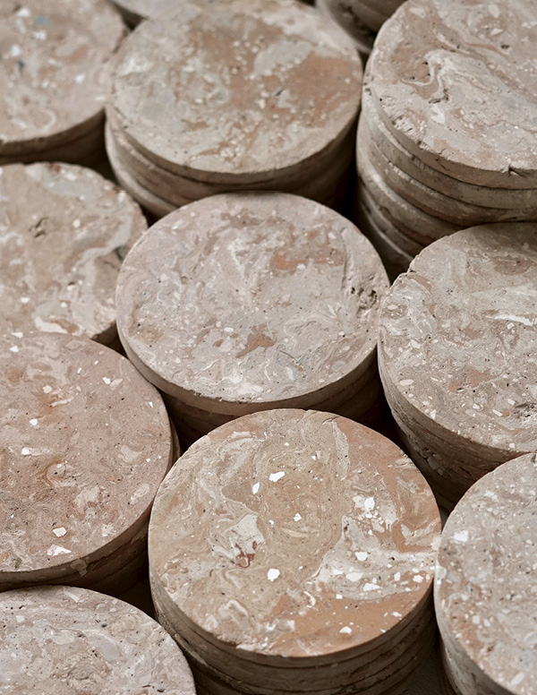 2 Press-molded sink-trap sediment and fired-seconds coasters.