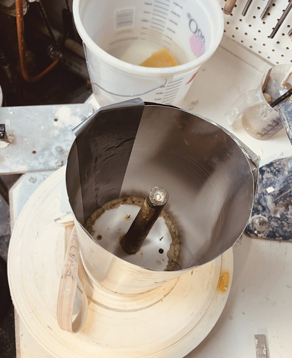 1 Aluminum flashing fashioned into a column creates a cylindrical cottle for liquid plaster.