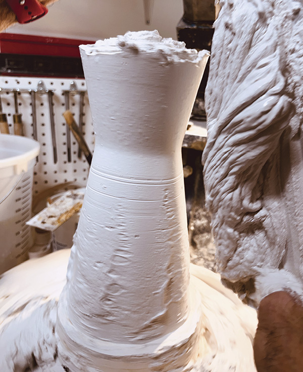 5 Continue to narrow the form to the desired diameter as the plaster begins to set.