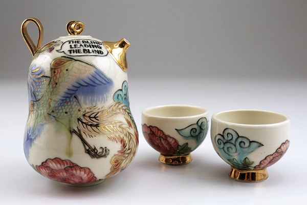1 Yoko Sekino-Bové’s Village Expert Teapot from the Genuine Fake China Series, to 5¹⁄₁₆ in. (12.8 cm) in diameter, porcelain, glazes, lusters, 2010.