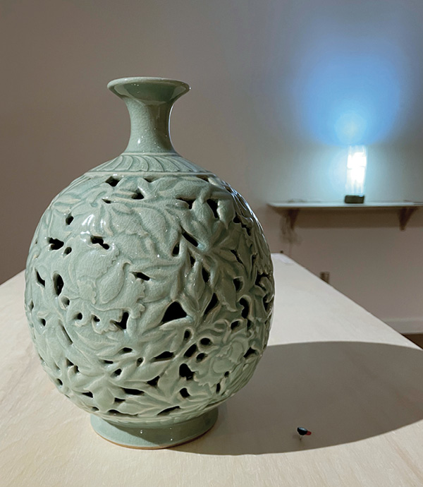 2 Gloria Jue-Youn Han’s peony bottle, stoneware, double-walled, openwork relief-carved scrolling, Korean celadon.