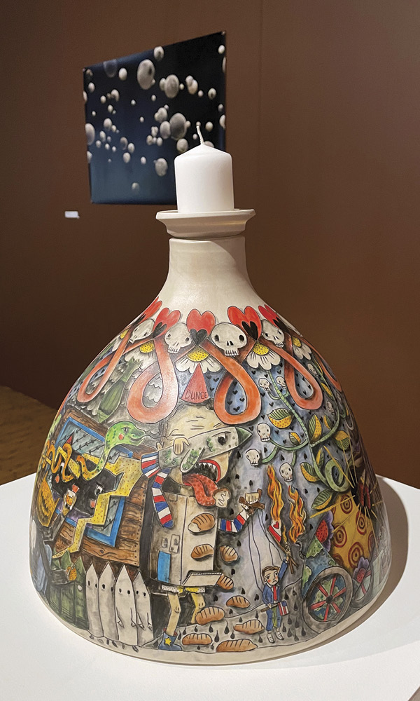 4 Carole Epp’s shining light on truth reveals hope, 131/2 in. (34.3 cm) in height, porcelain, mishima technique, underglaze, fired in oxidation to cone 6, acrylic, graphite, varnish, 2025. Vessel was thrown by tech Ken Wilkinson.