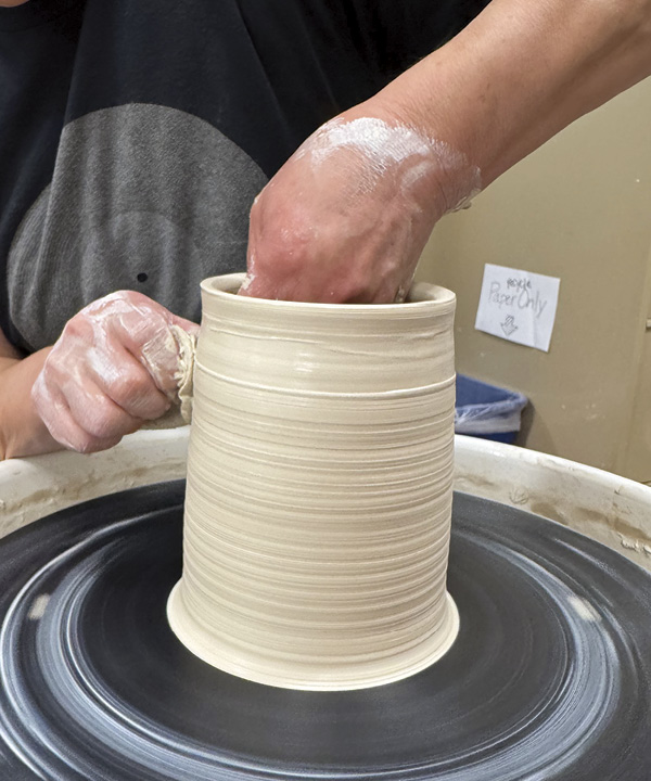 7 Pull the wall up a third time.