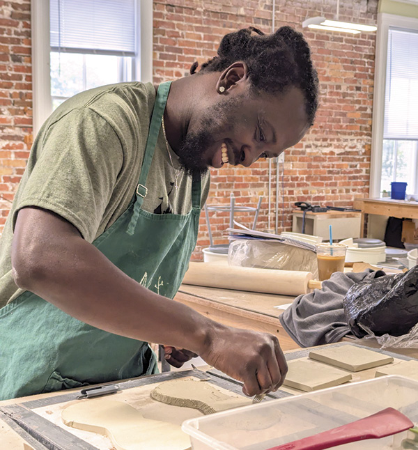 5 Student, Emmanuel Asamoah (KStony), making a vase during a workshop with Katie Bosley Sabin, June 2025.