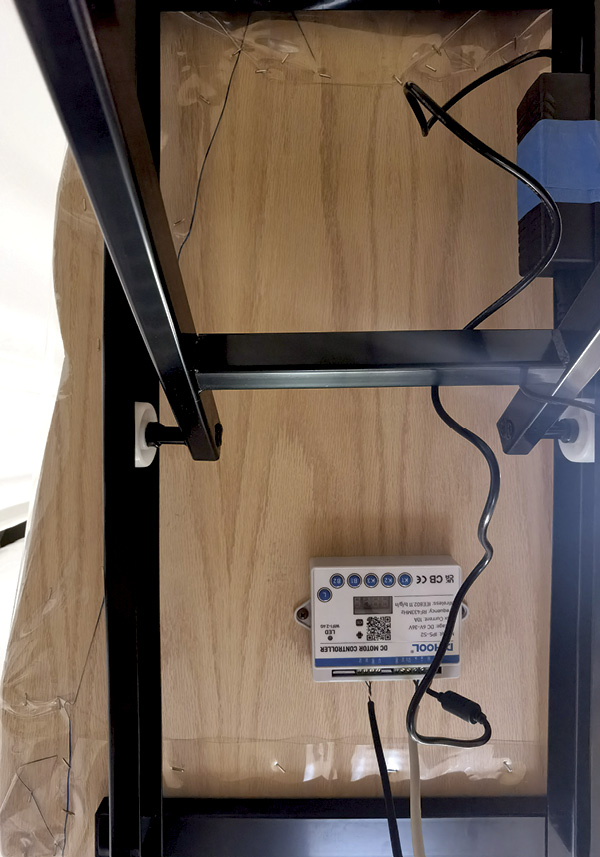 3 Attach the painted platform to the lift, and then attach the controller to the underside of the plywood.