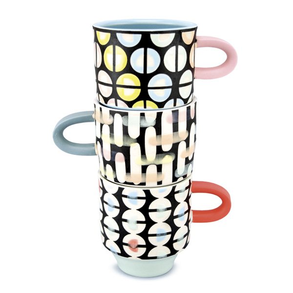 3 Adrienne Eliades’ Stacking Cups, 5 in. (13 cm) in width, white stoneware, underglaze stencils, glazes.