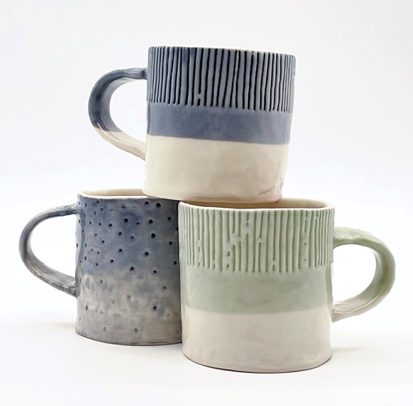 Mug variations, 3½ in. (9 cm) in height (each), porcelain, slip, glaze, 2023.