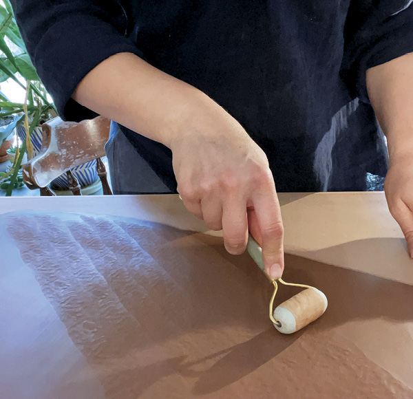 1 Roll a slab with homemade pinch-textured pony roller.