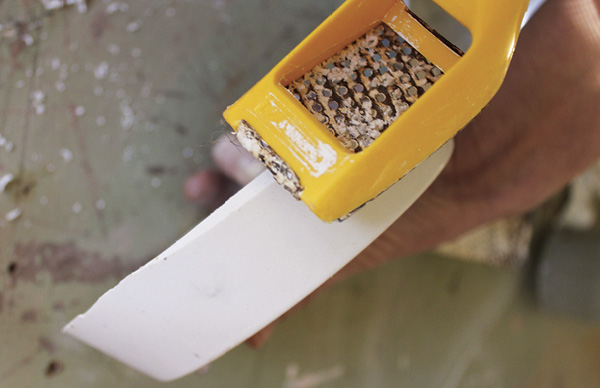 3 After removing your plaster positive, use a rasp to bevel the edge to avoid chipping during use and storage.