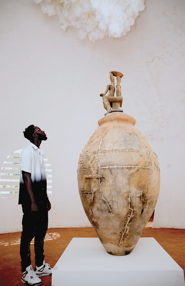 6 An audience gazes at Frederick Ebenezer Okai's When the Gods Speak, Heaven Listens, from the solo exhibition “Earthy Structures and Contingent Breakthroughs,” 2022.