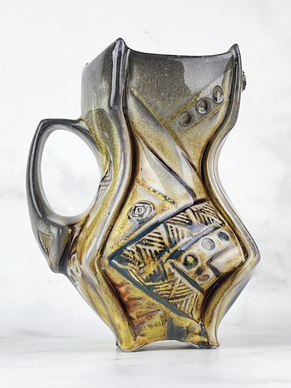 Newman's Skittles and Rainbows Maker’s Mug, 5.5 in. (14 cm) in height, Laguna B-mix 10 (porcelaneous stoneware), thin spray of Tenmoku, Galactic Indifference sprayed as a second layer, fired in reduction to cone 12 in a 36-hour wood and soda kiln, 2024.