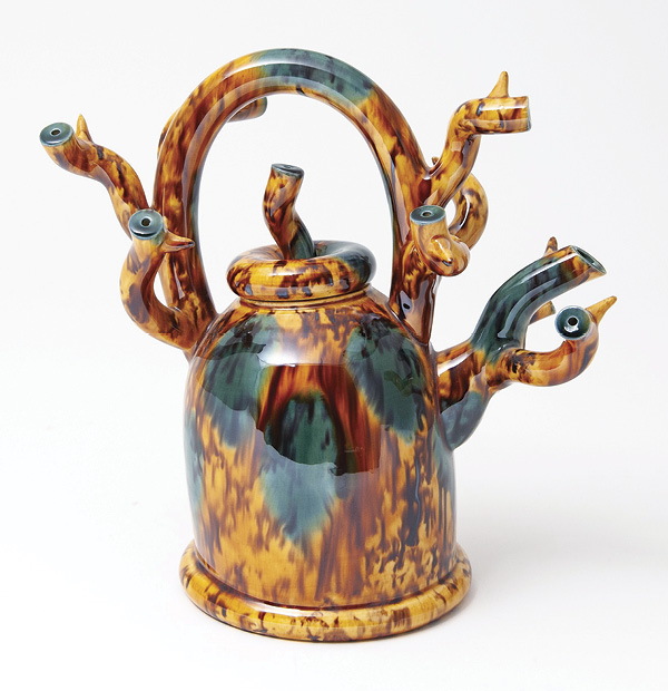 1 Walter Keeler's Contorted Branch Teapot, 10 in. (23 cm) in width, earthenware, yellow polychrome, fired in an electric kiln, 2017. Photo: Goldmark Gallery.