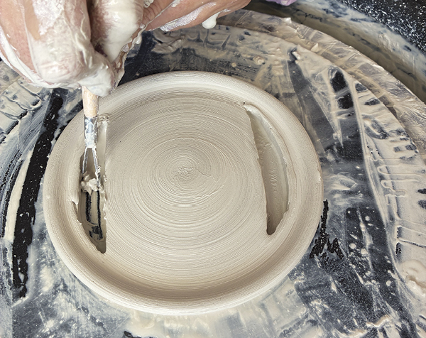 5 Use a trimming tool to remove any residue on the wheel head.