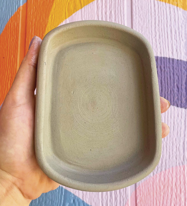 8 Once leather hard, remove from the bat and use a rib to compress the underside and top of the two seams.