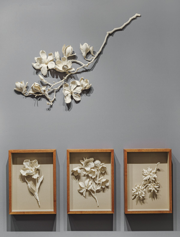 2 Above: Magnolia III, 2022. Below: Spring Flower Specimen Series, stoneware in linen-backed oak frame, 2022.