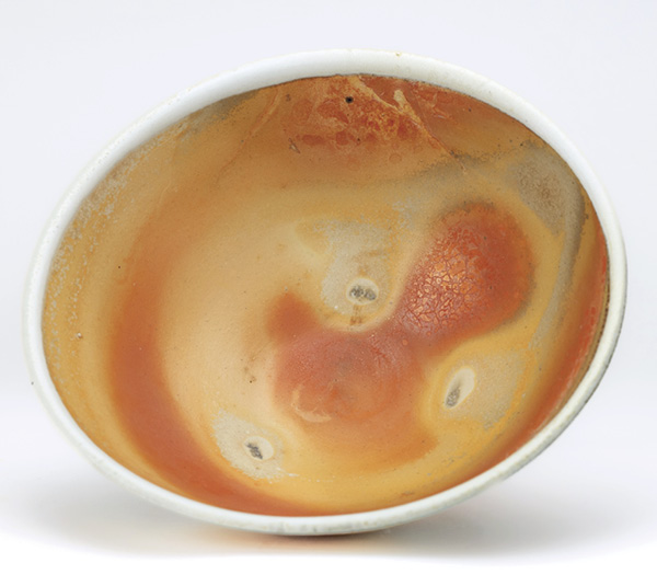 3 Johnny Arvizu’s ramen bowl, 7¾ in. (20 cm) in width, Arvizu Test Soda Clay, Arvizu Variation of Bisque Flash Flashing Slip, Leach White Glaze applied to the rim, soda fired to cone 10 in an oxidized area of the kiln, reduction cooled.