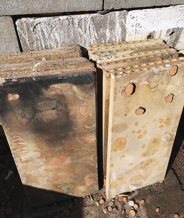 1 Kiln shelves from the Rothshank kiln complex. Pictured are mullite/cordierite shelves on the left and CoreLite shelves on the right.