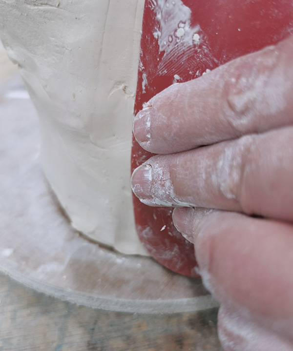 3 Join the slabs together, compressing with a kidney rib.