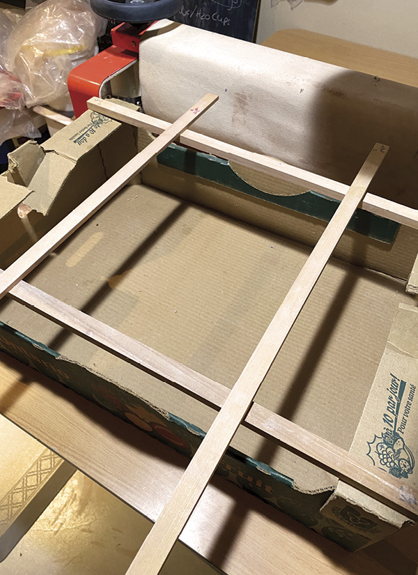 3 Arrange supports to keep the cardboard slump mold elevated.