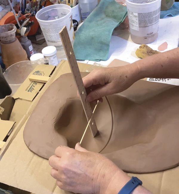 6 Drape and form a second slab into the slump mold, and measure its interior depth.