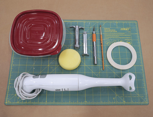 1 Gather tools for preparing slip and dry materials.